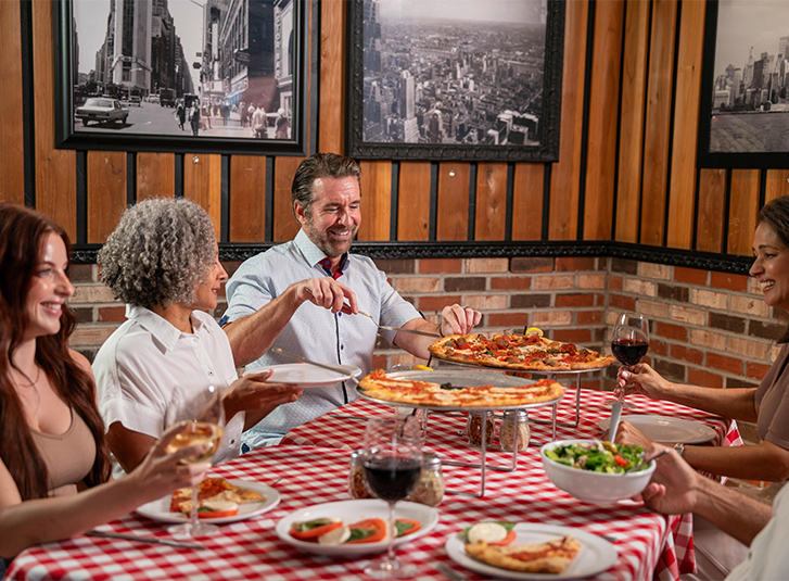Families create memorable moments over Grimaldi's expansive menu offerings.
